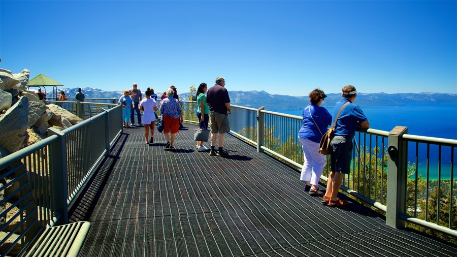 Heavenly Mountain Gondola which includes a lake or waterhole and views as well as a small group of people
