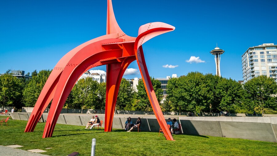 Olympic Sculpture Park featuring outdoor art and a park as well as a small group of people