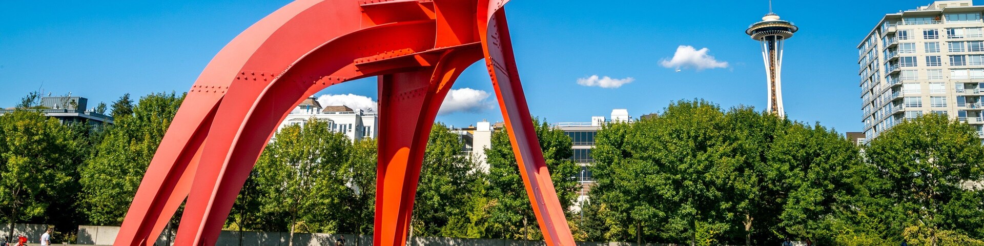 Olympic Sculpture Park featuring outdoor art and a park as well as a small group of people