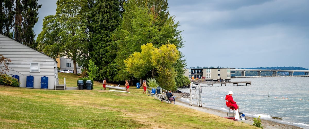 Madison Park Beach which includes a garden and a lake or waterhole