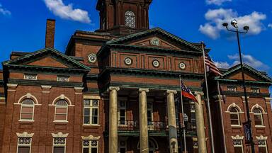 Newnan Georgia historic city courthouse with a blue sky background