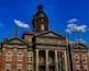 Newnan Georgia historic city courthouse with a blue sky background