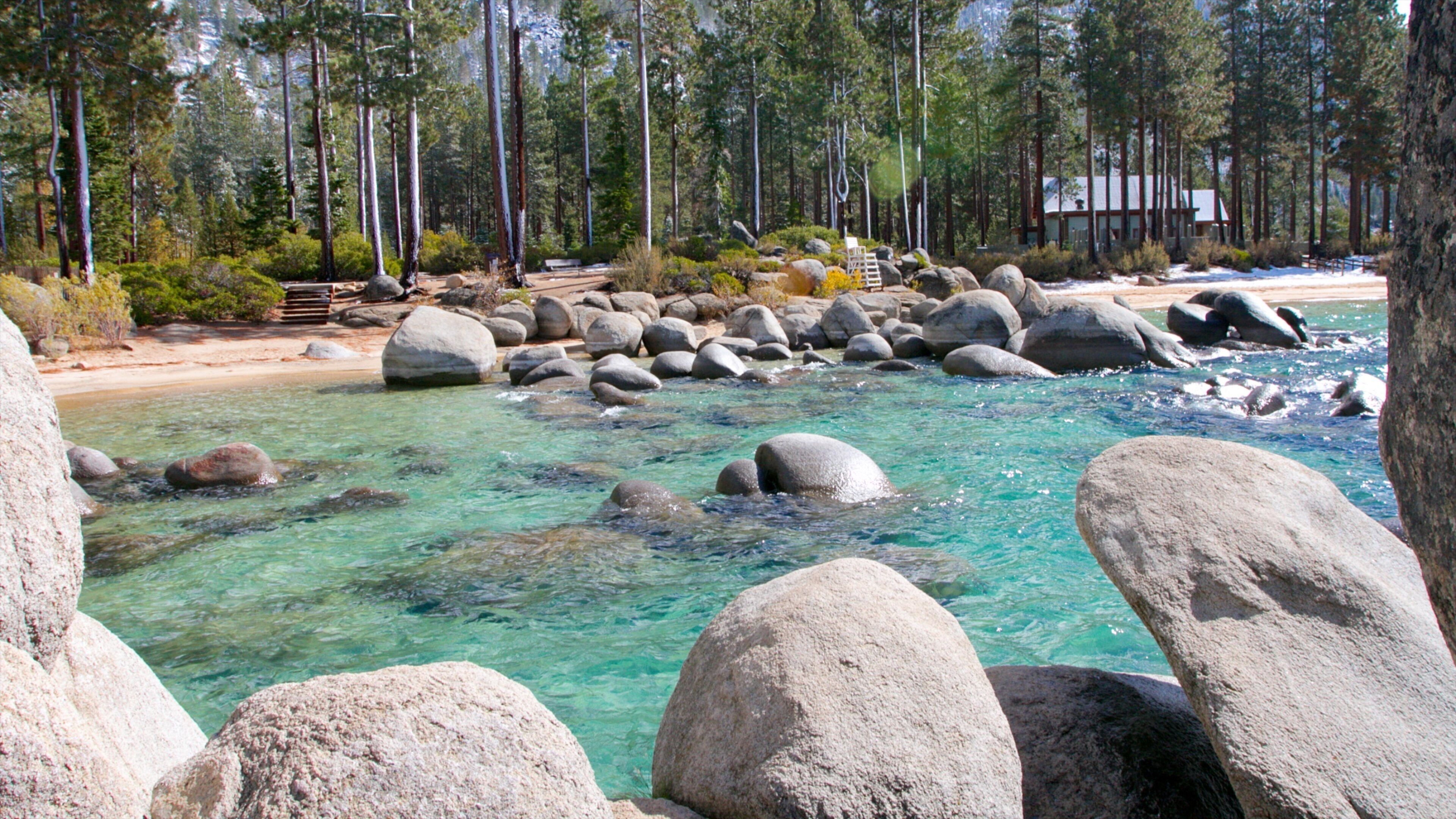 Sand Harbor of Lake Tahoe Nevada State Park which includes rugged coastline, forests and landscape views