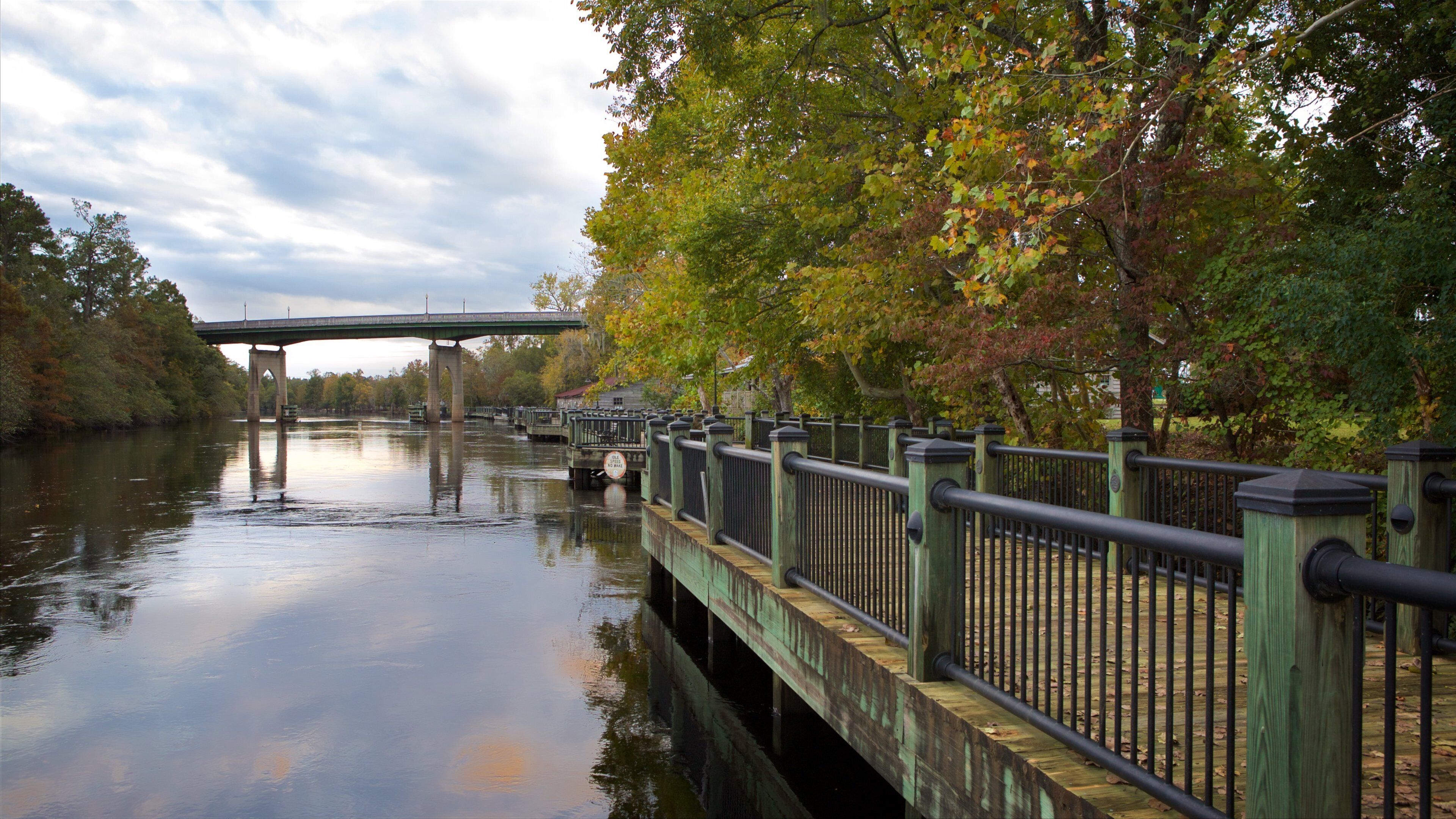 Conway Riverwalk featuring a bridge, wetlands and a river or creek
