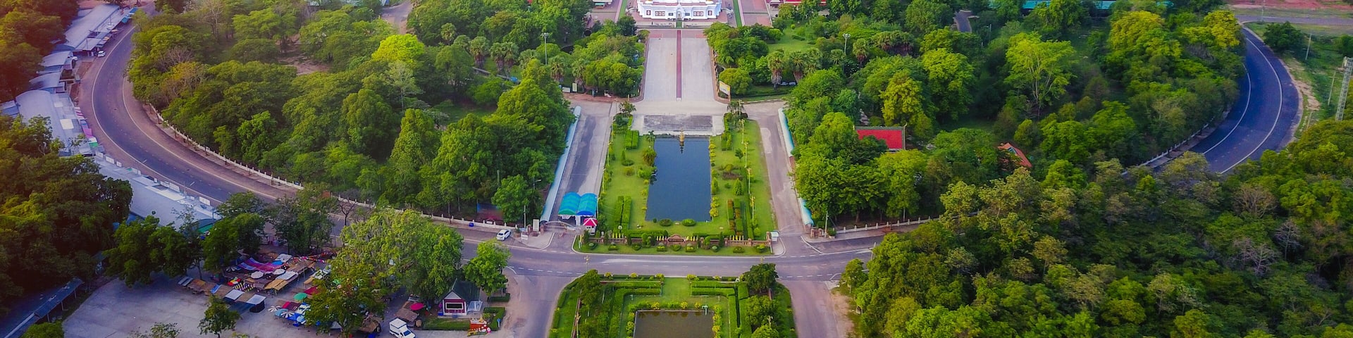Aerial view of Phra That Nadoon or Wat Na Dun Pagoda at sunrise, Beautiful landmark and famous holy Buddha place in Maha Sarakham, Thailand.