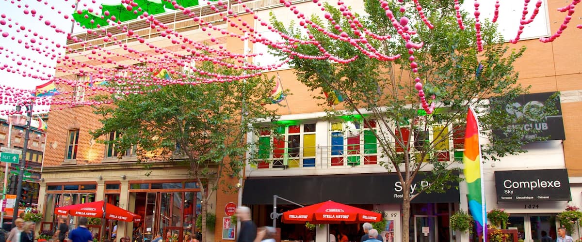 Gay Village montrant signalisation, scĂšnes de rue et sortie au restaurant