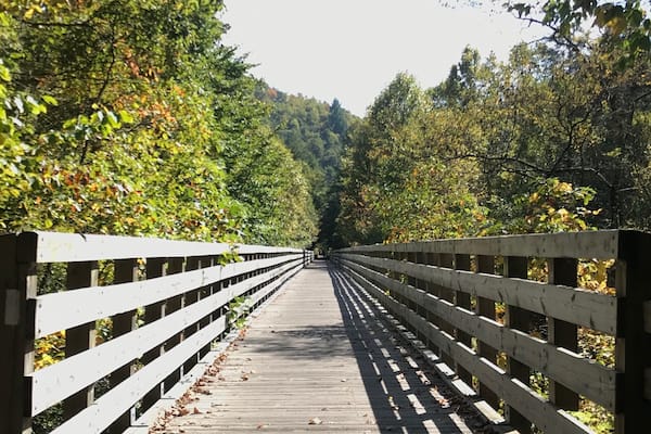 Running 18 miles from Whitetop Station to Damascus, the Virginia Creeper Trail is one of the most beautiful “rail trails” in the eastern United States. Along the way, you’ll cross approximately 30 old bridges, several with beautiful views of the surrounding countryside. Plan on visiting in mid-October for the best fall colors.
