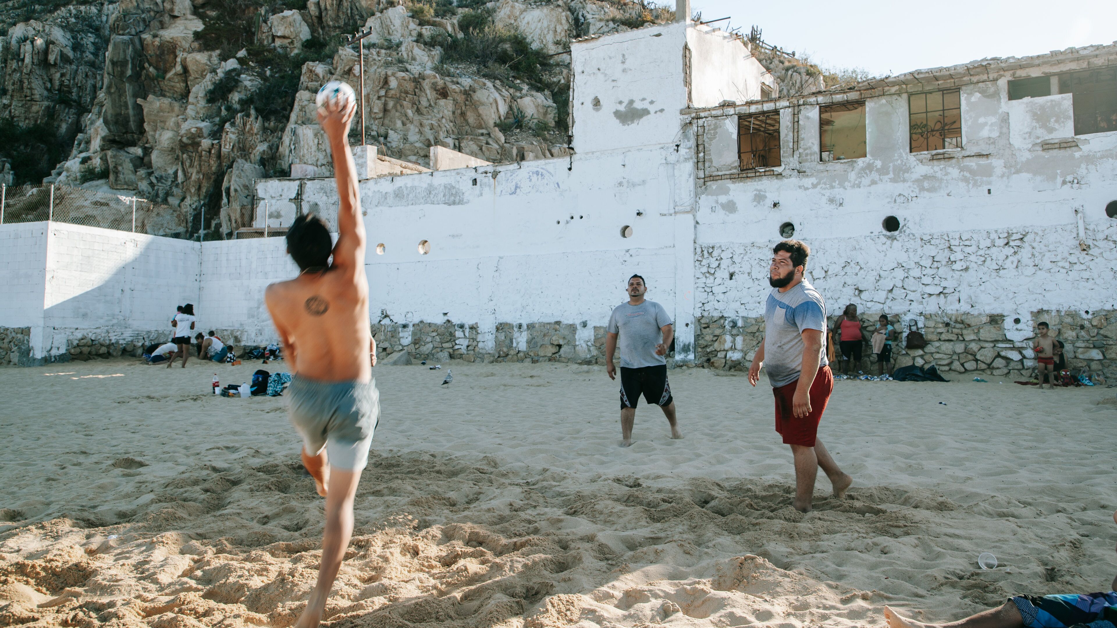 Cannery Beach showing a beach as well as a small group of people
