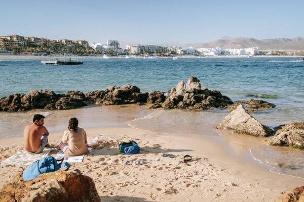 Cannery Beach which includes general coastal views and a beach as well as a couple