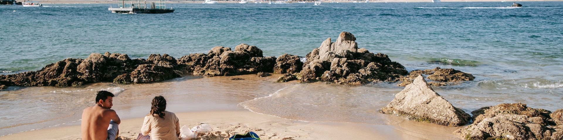 Cannery Beach which includes general coastal views and a beach as well as a couple