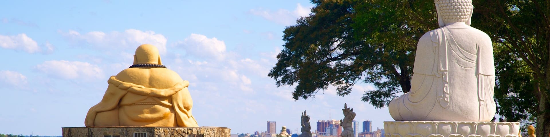 Buddhist Temple featuring a temple or place of worship, religious elements and a statue or sculpture