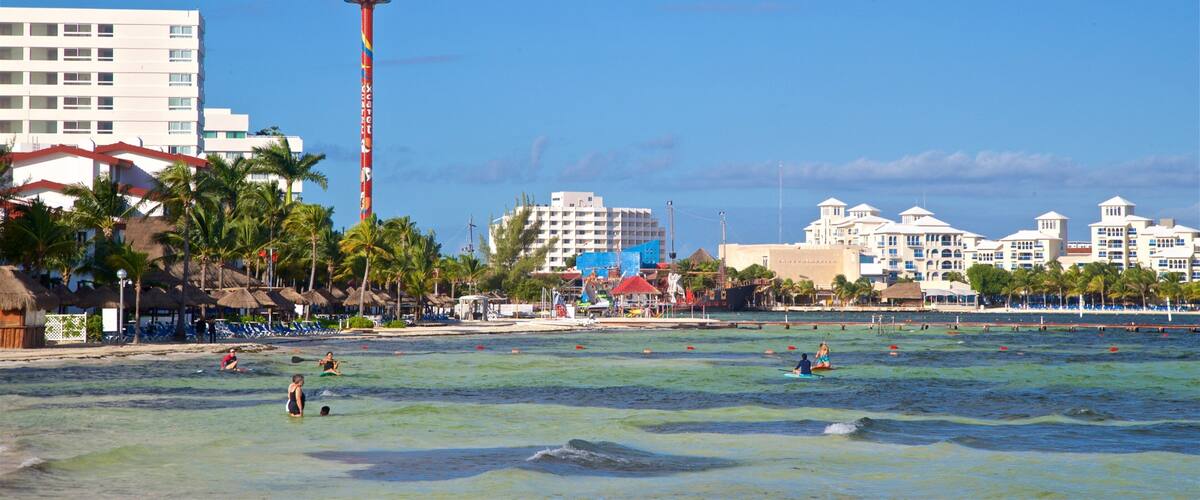 Escénica Tower featuring swimming, a coastal town and general coastal views