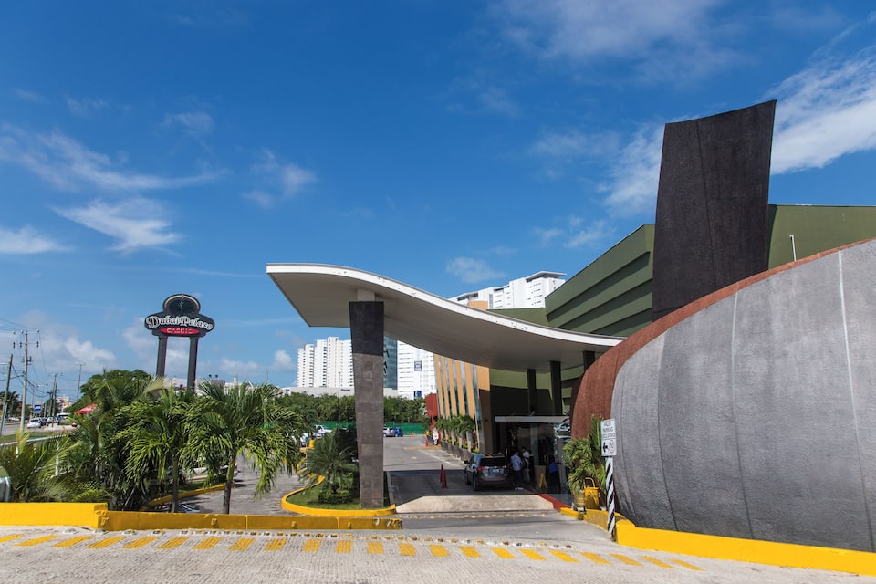 A modern building with a curved roof and a sign reading "Duchess Palace."