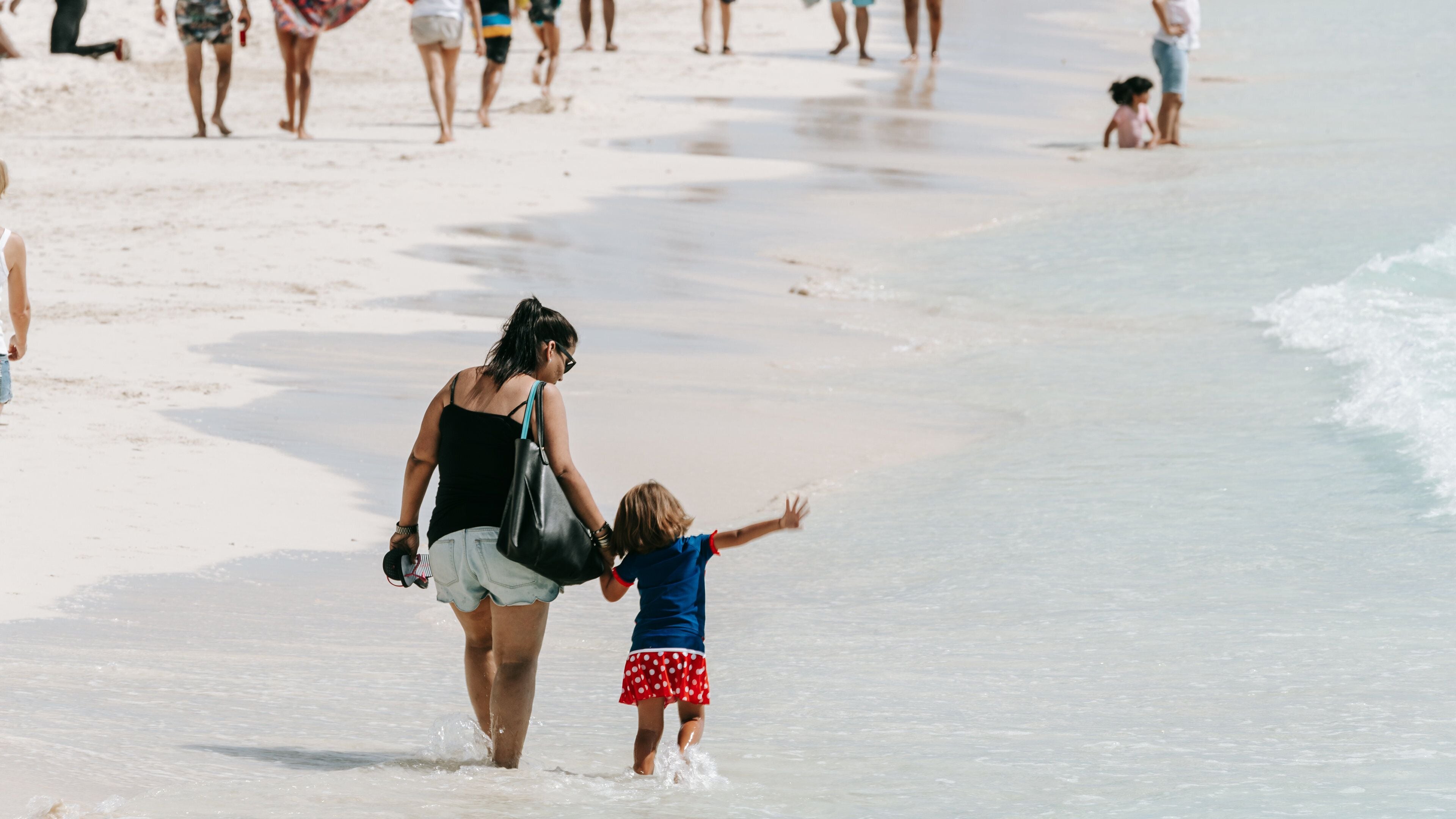 Gaviota Azul Beach featuring general coastal views and a sandy beach as well as a family