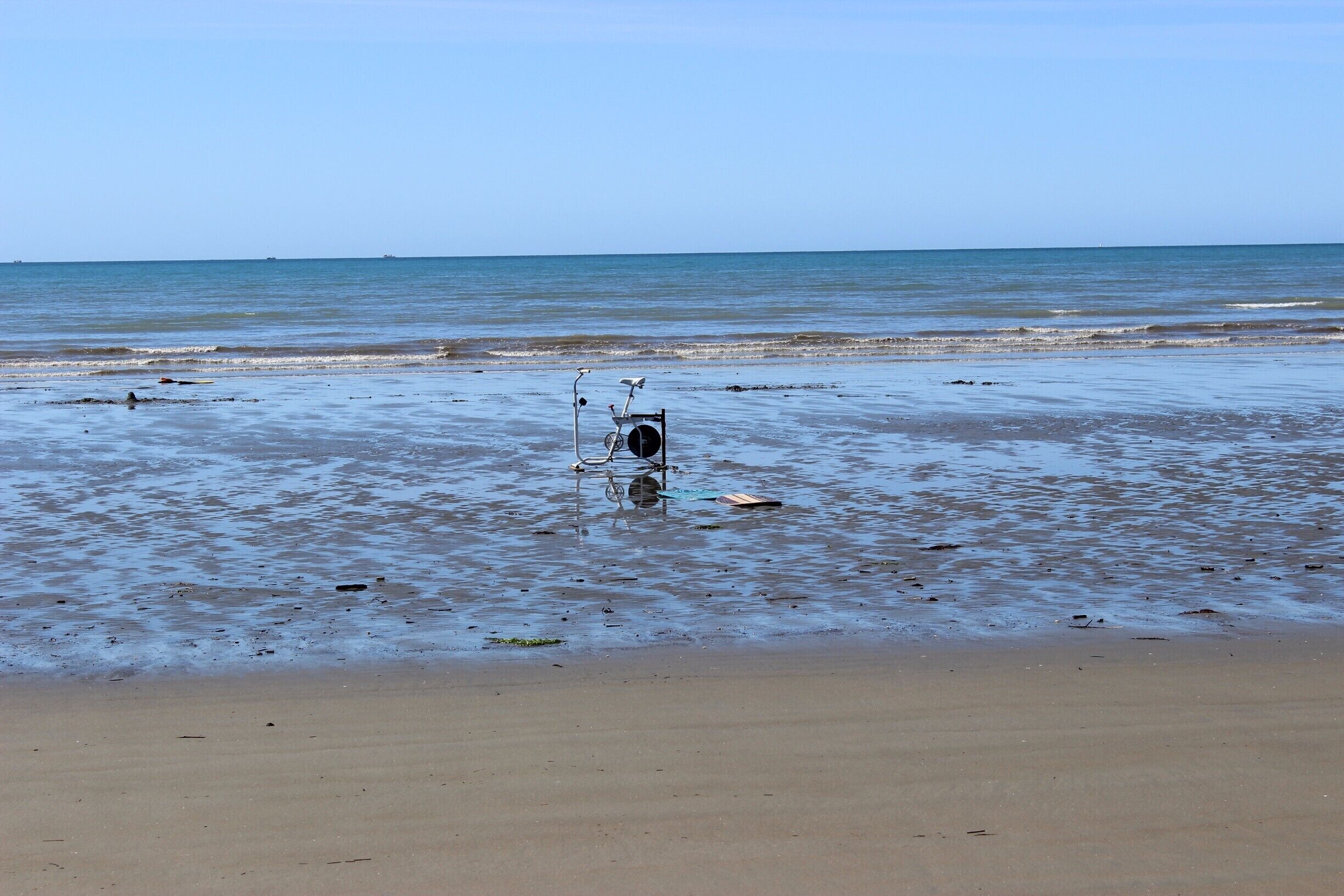 An exercise bike reveals itself at low tide on Pohara Beach. Resistance training Kiwi-style? #LifeAtExpedia