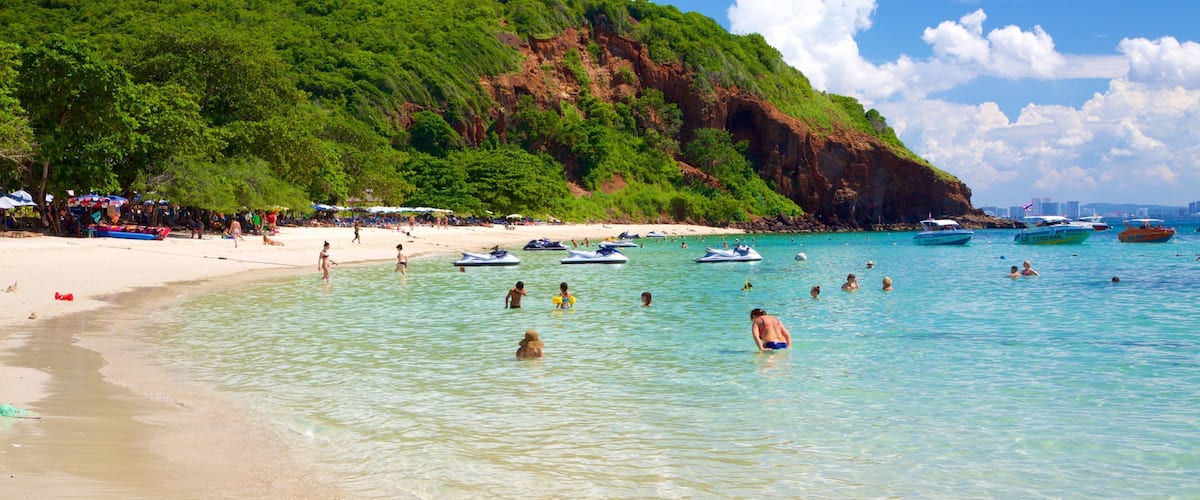 Nual Beach which includes a beach and swimming as well as a large group of people