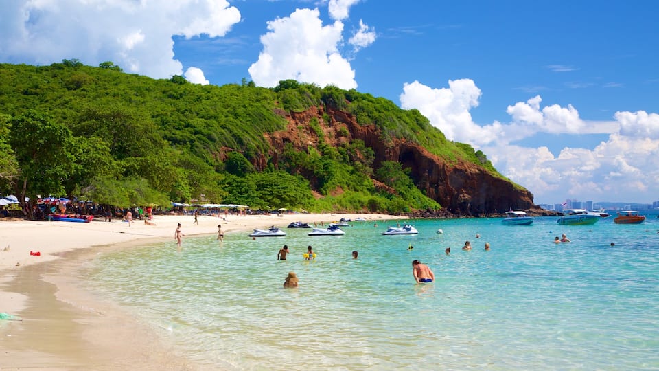 Nual Beach which includes a beach and swimming as well as a large group of people