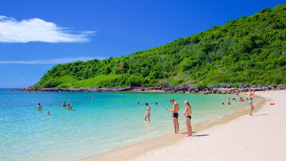 Nual Beach which includes swimming and a beach as well as a large group of people