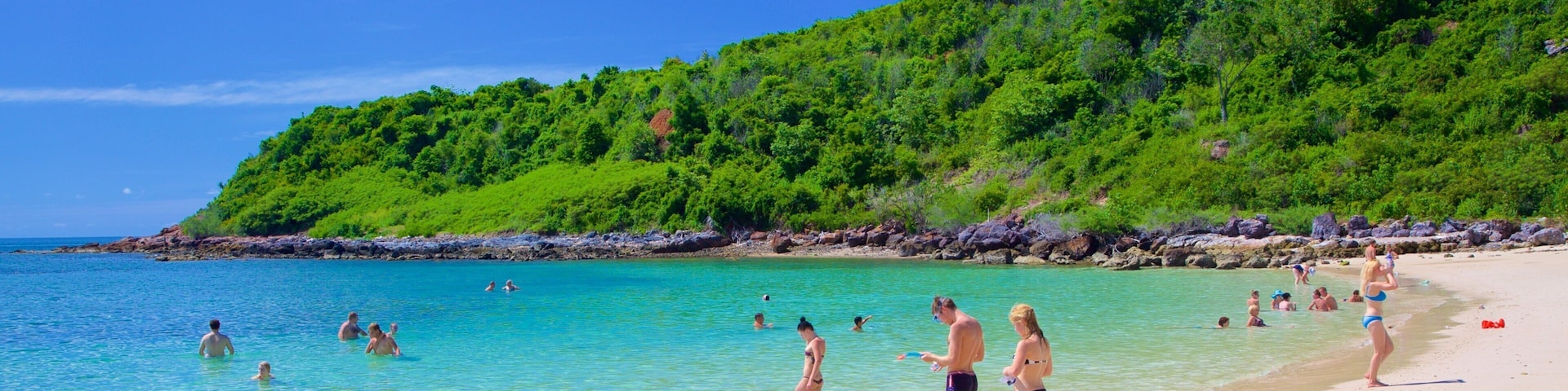 Nual Beach which includes swimming and a beach as well as a large group of people