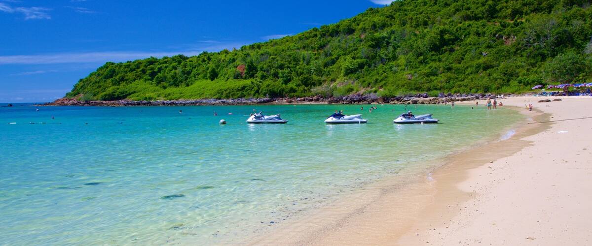 Nual Beach which includes a sandy beach and jet skiing