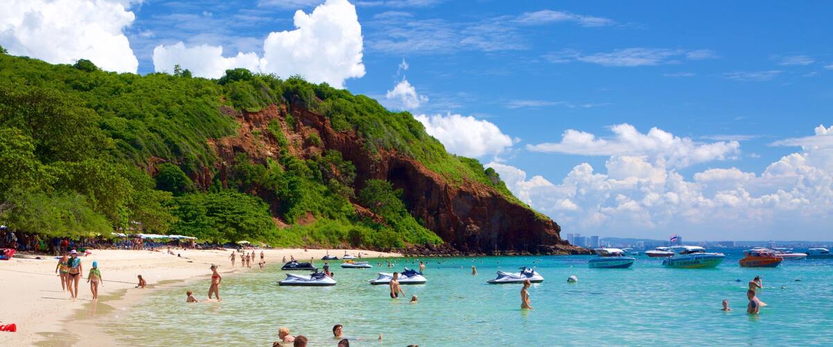 Nual Beach which includes swimming and a bay or harbour as well as a large group of people