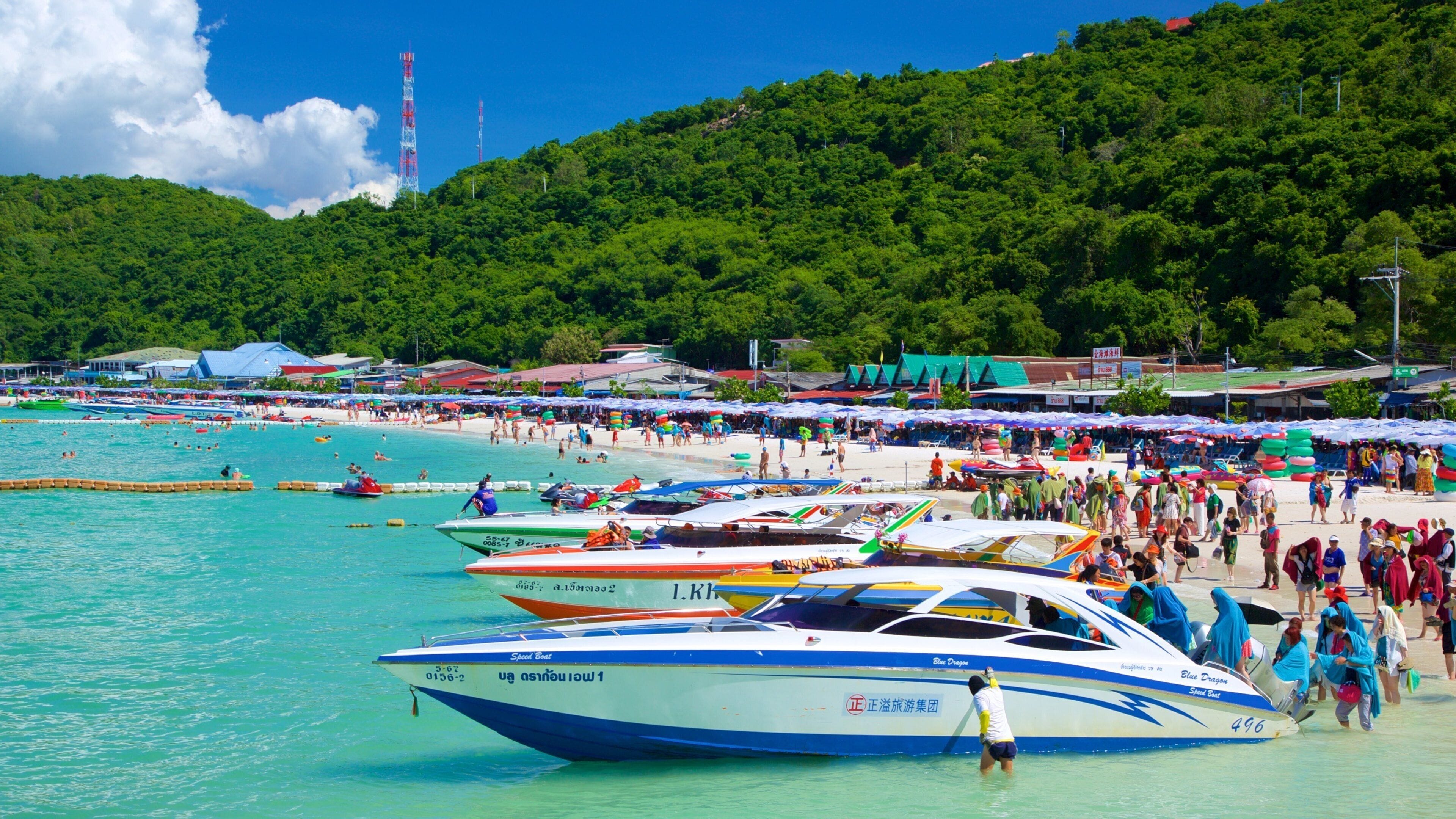 Ta-Yai Beach which includes boating and a sandy beach as well as a large group of people
