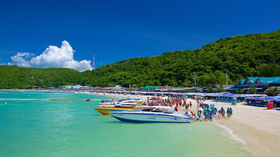 Ta-Yai Beach featuring a sandy beach and boating as well as a large group of people