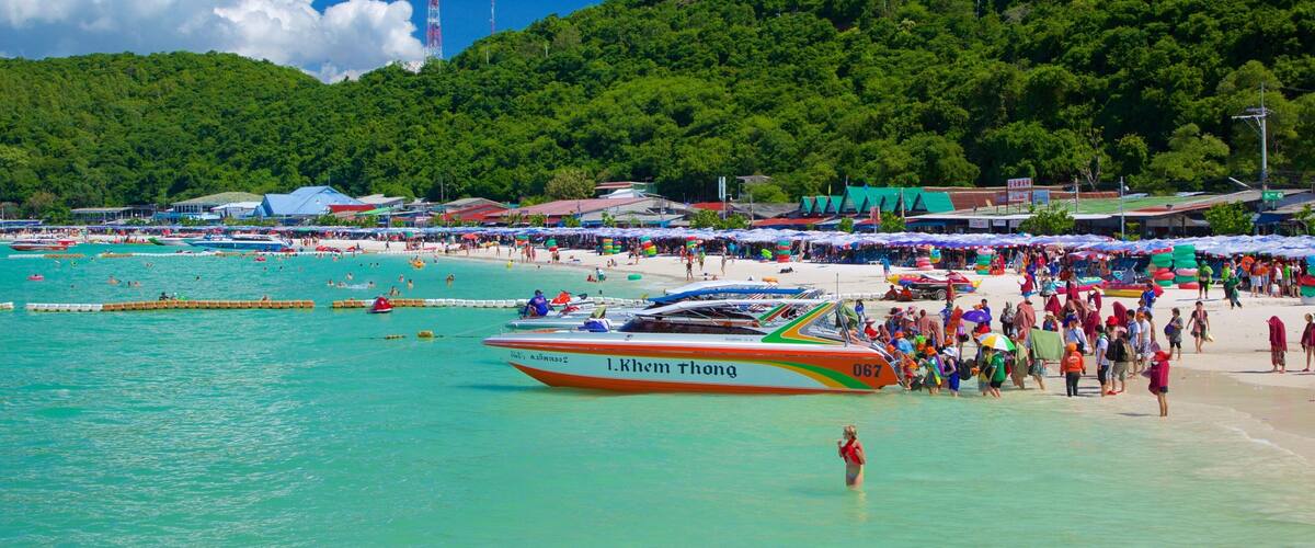 Ta-Yai Beach featuring boating and a sandy beach as well as a large group of people