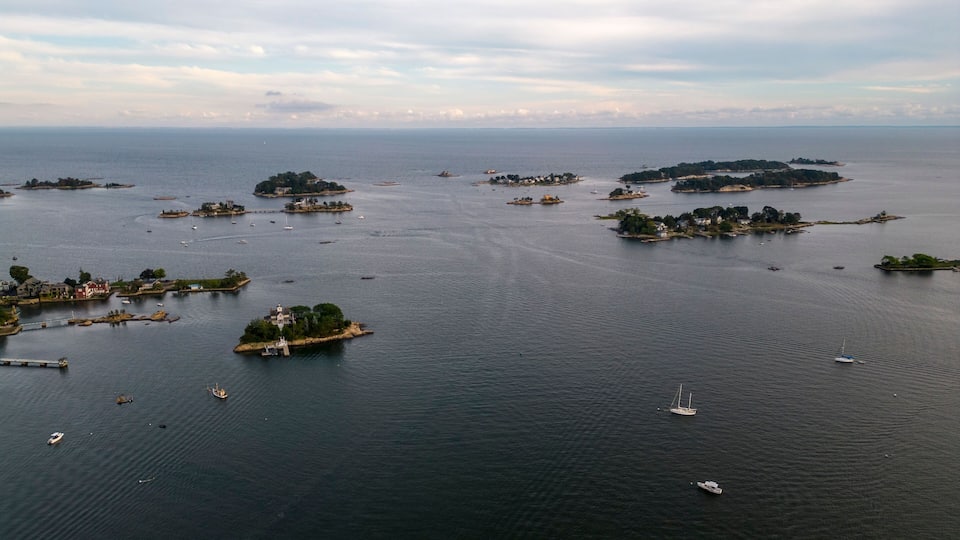 A coastal area with multiple small islands and a large body of water.