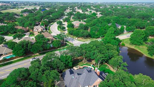 Briarhill and Highland Shores Boulevard intersection near western branch of Lewisville Lake in upscale residential neighborhood, mansion homes large lots swimming pool, Highland Village, Texas