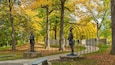 Queenston Heights Park which includes fall colors, a statue or sculpture and a garden