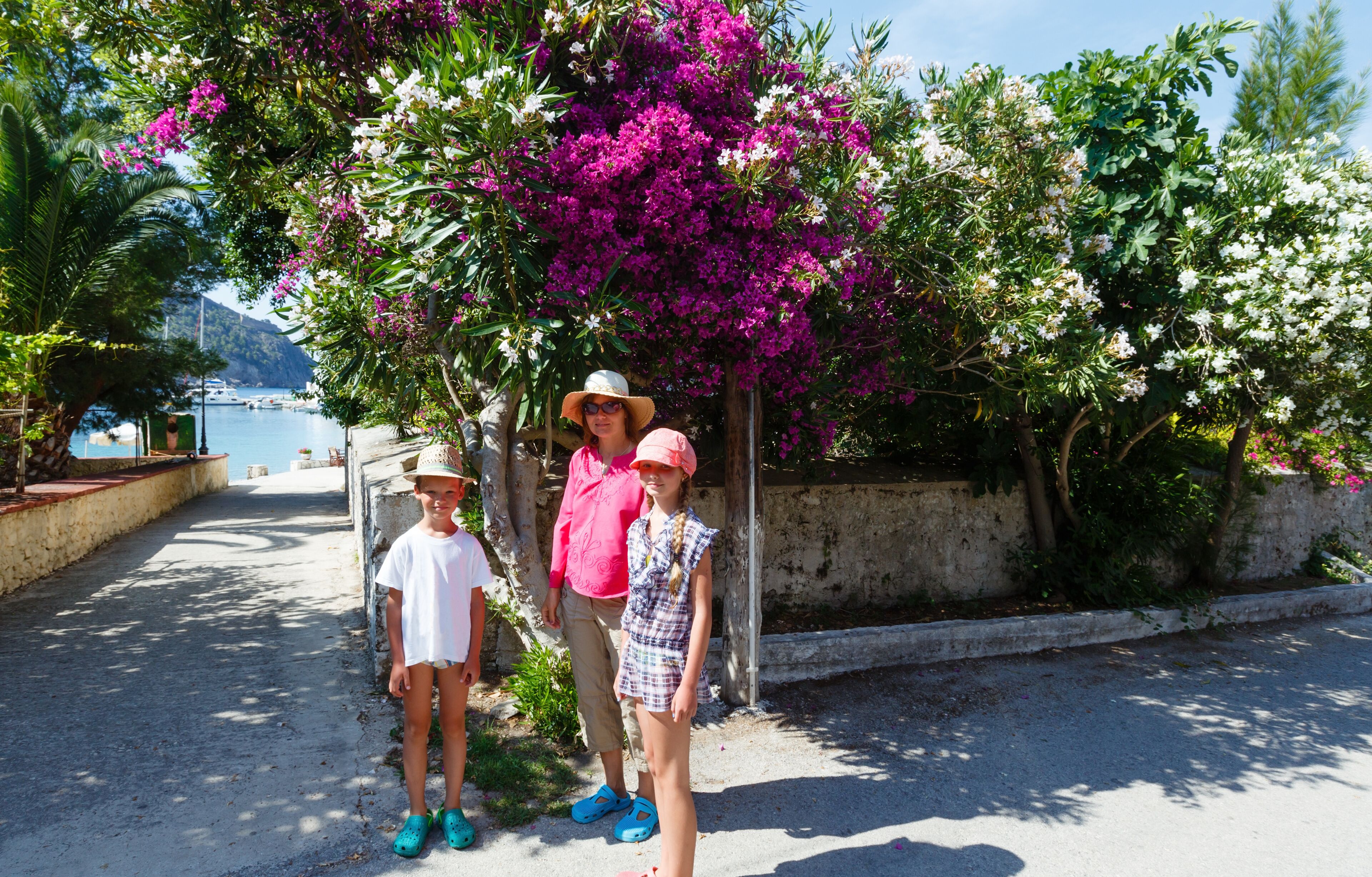 Family on street in Assos village (Greece, Kefalonia)