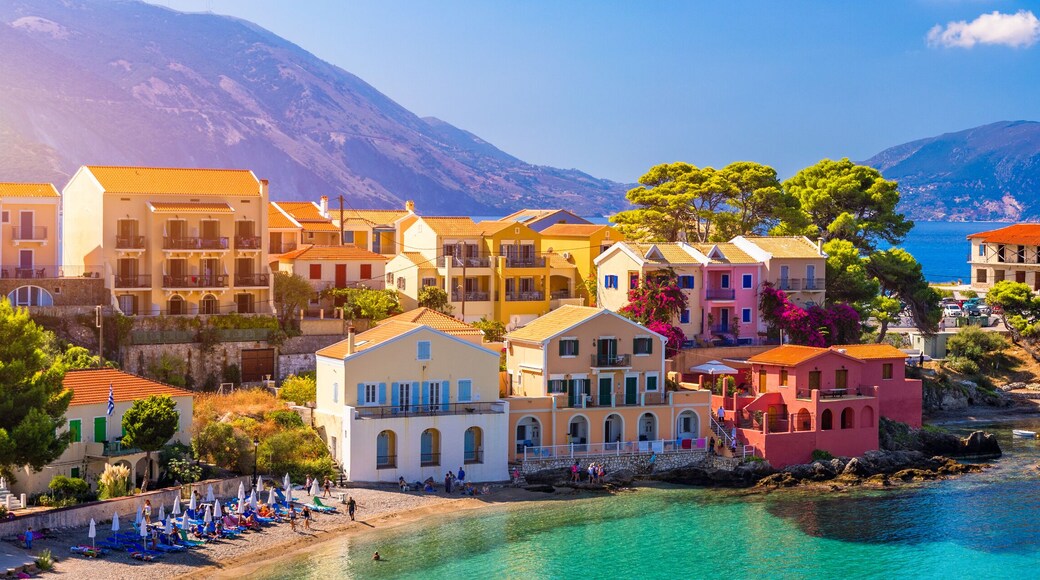 Assos village in Kefalonia, Greece. Turquoise colored bay in Mediterranean sea with beautiful colorful houses in Assos village in Kefalonia, Greece, Ionian island, Cephalonia, Assos village.