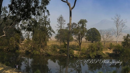 The magic view from our camp at Flanagans Reserve bush camping in the foothills of Mt Barney in SE QLD. You can see Mt Barney in the background through the fog and smoke haze. There was a bushfire the other side of Mt Barney when this was taken.
The photo is a 3 photo panno.