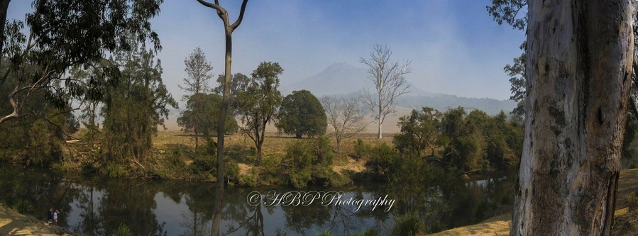 The magic view from our camp at Flanagans Reserve bush camping in the foothills of Mt Barney in SE QLD. You can see Mt Barney in the background through the fog and smoke haze. There was a bushfire the other side of Mt Barney when this was taken.
The photo is a 3 photo panno.
