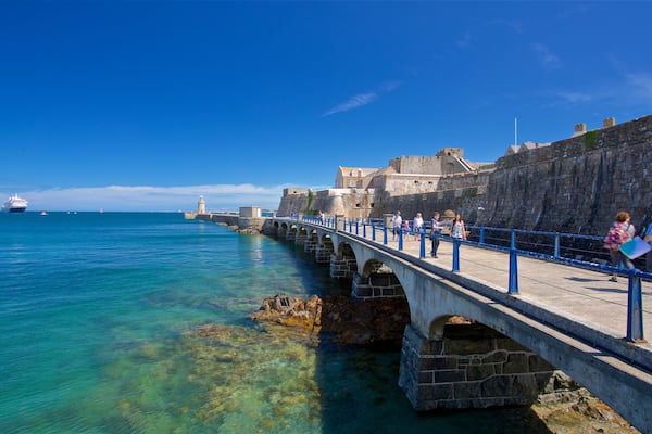 Castle Cornet which includes a bridge and general coastal views as well as a small group of people