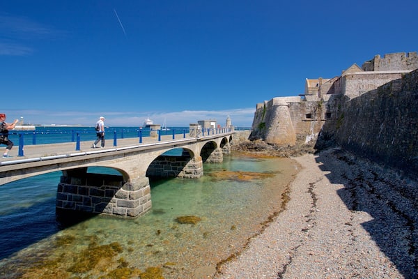 Castle Cornet featuring heritage elements, a bridge and general coastal views