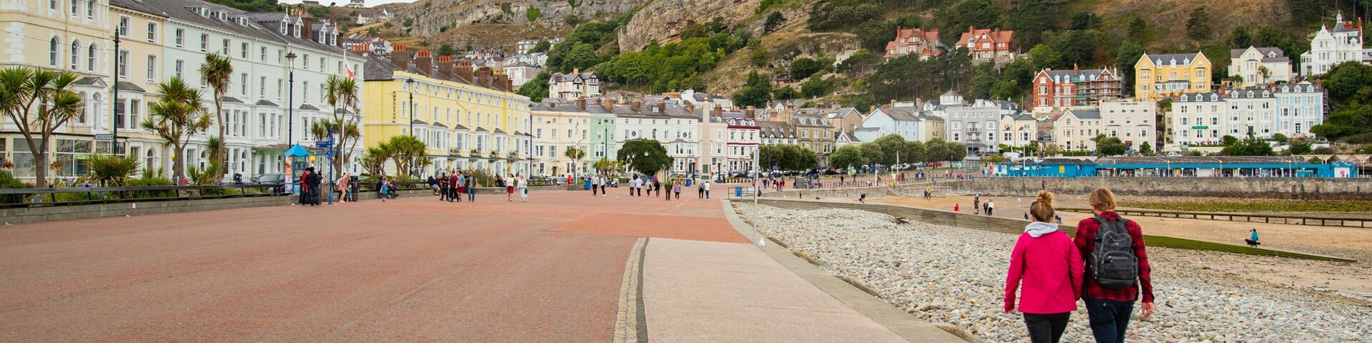 Promenade which includes a coastal town as well as a couple