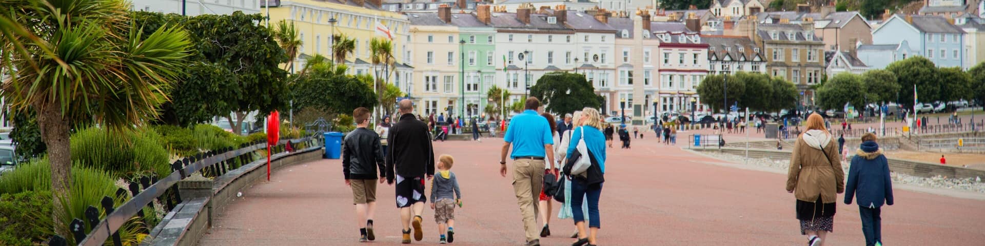 Promenade featuring a small town or village as well as a small group of people
