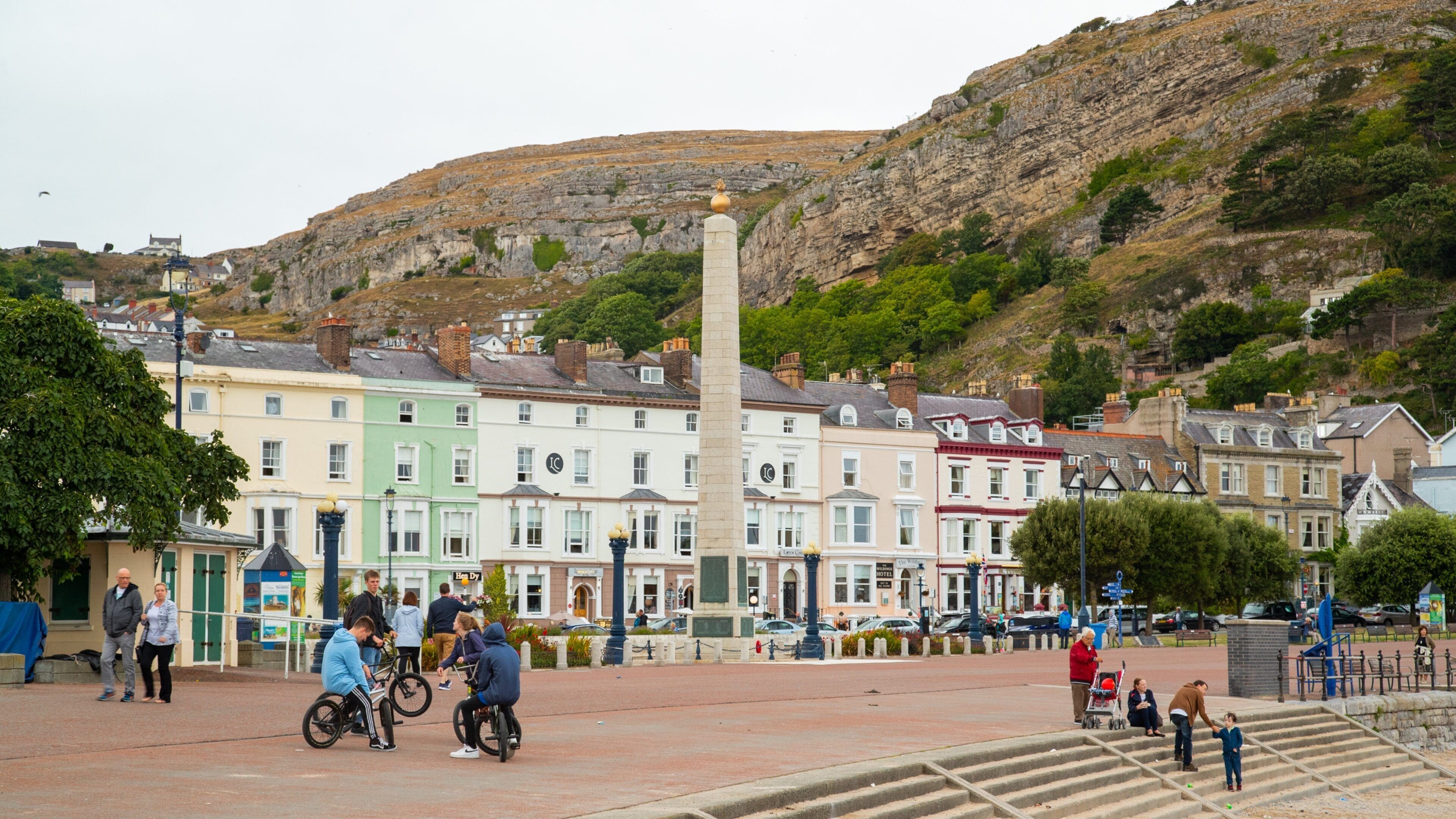 Promenade which includes a small town or village as well as a small group of people