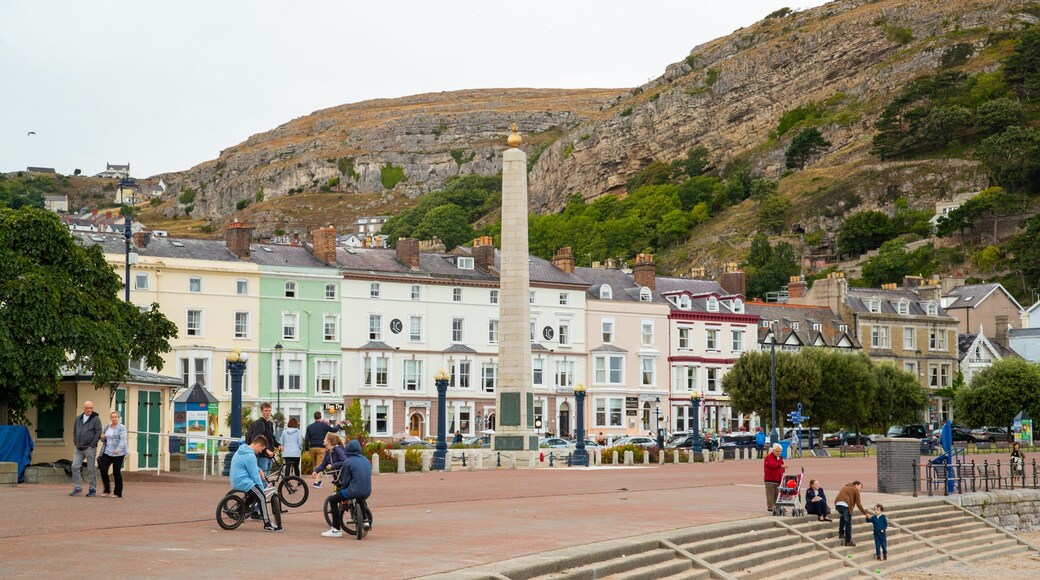 Promenade which includes a small town or village as well as a small group of people