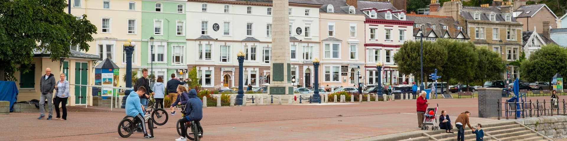 Promenade which includes a small town or village as well as a small group of people