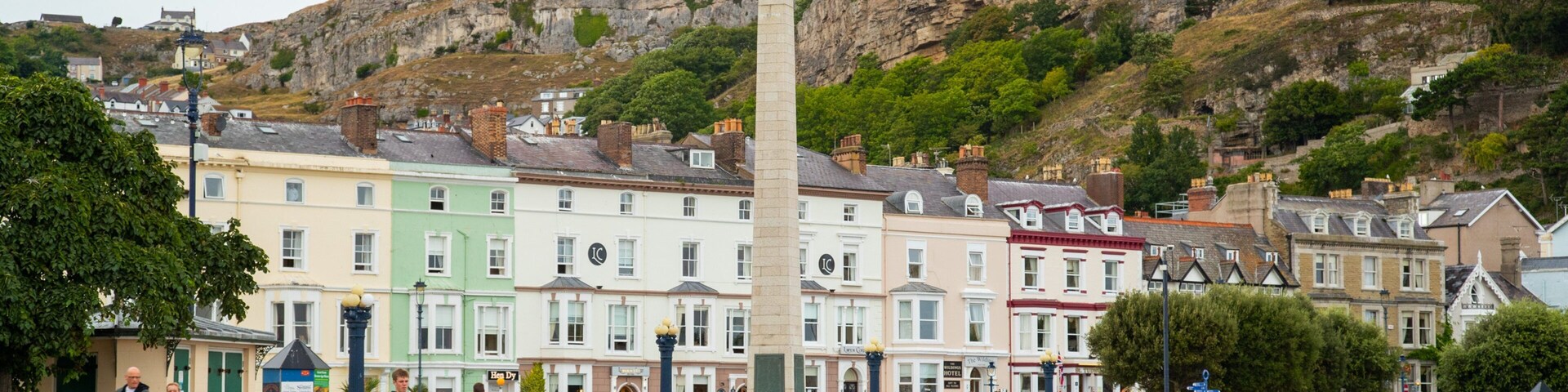 Promenade which includes a small town or village as well as a small group of people