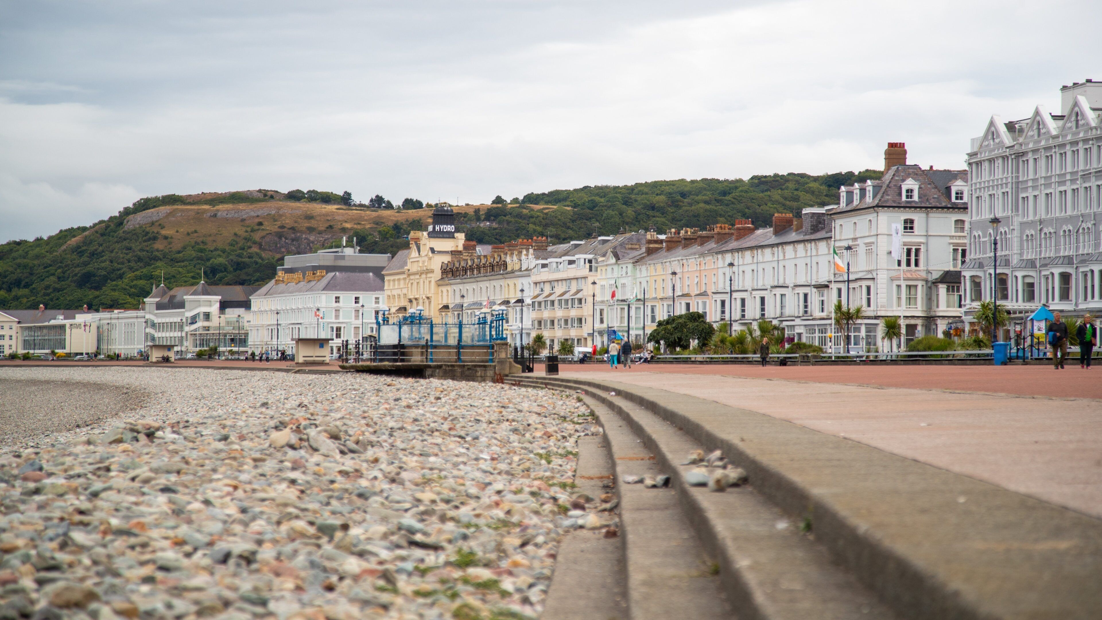 Promenade showing a coastal town and a pebble beach