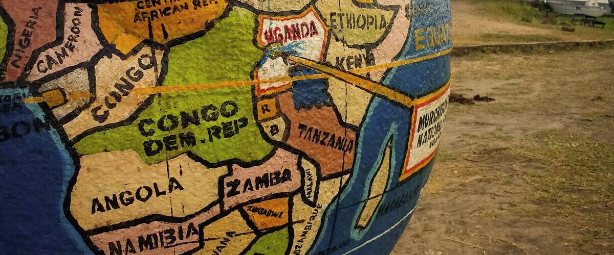 A globe with highlighted regions including Egypt, Sudan, and Uganda.