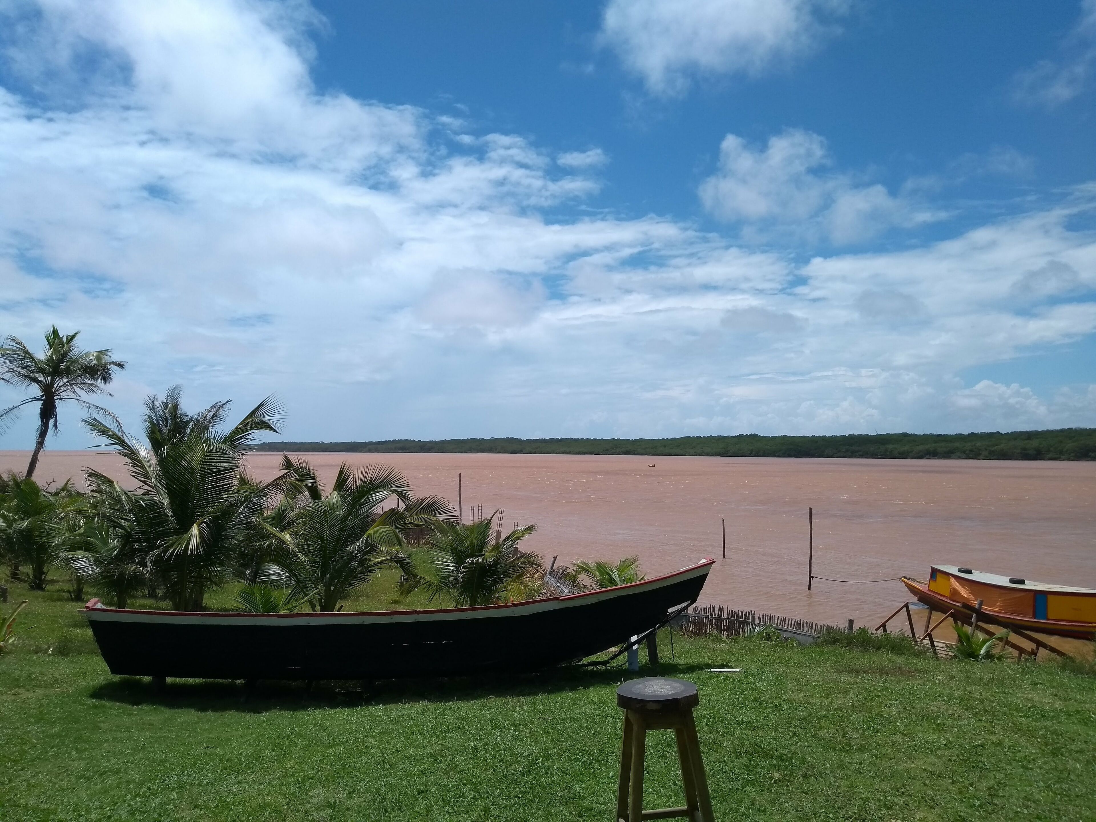 Photo of a boat stopped near the Parnaíba river. Brazilian river, located in the State of Piauí with beautiful landscapes.