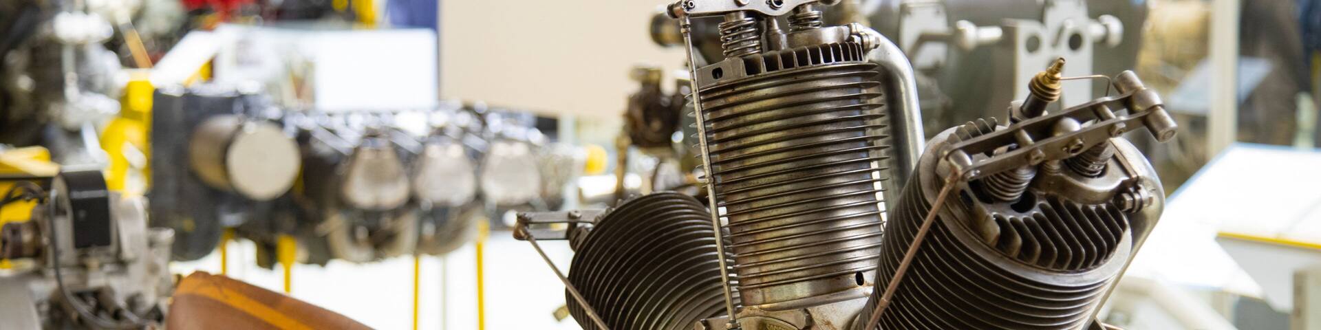 A detailed engine with visible components and a wooden propeller.