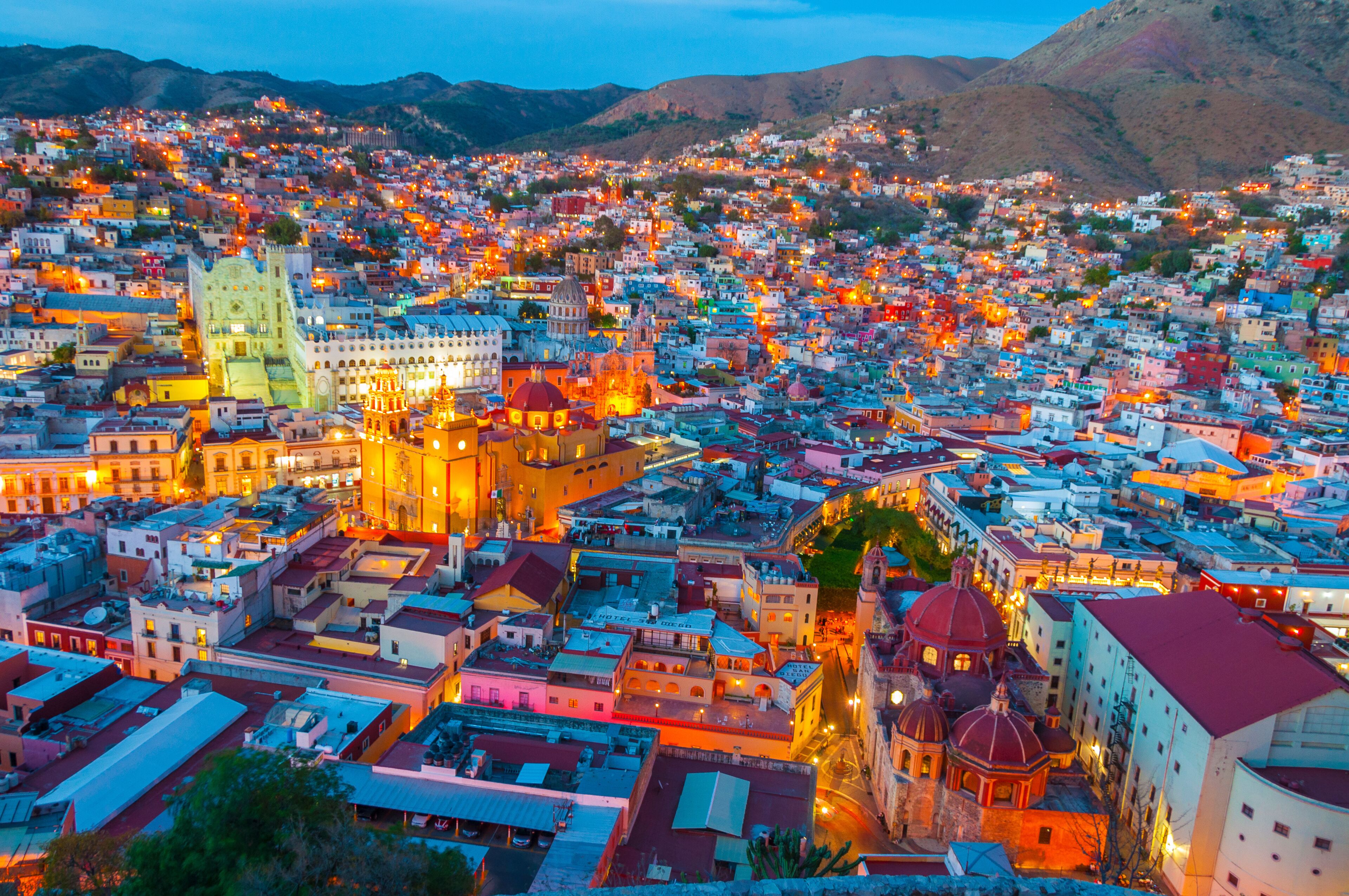 A cityscape with a prominent cathedral and surrounding buildings.