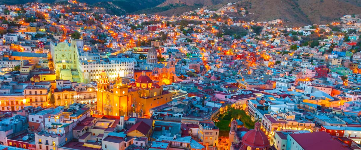 A cityscape with a prominent cathedral and surrounding buildings.