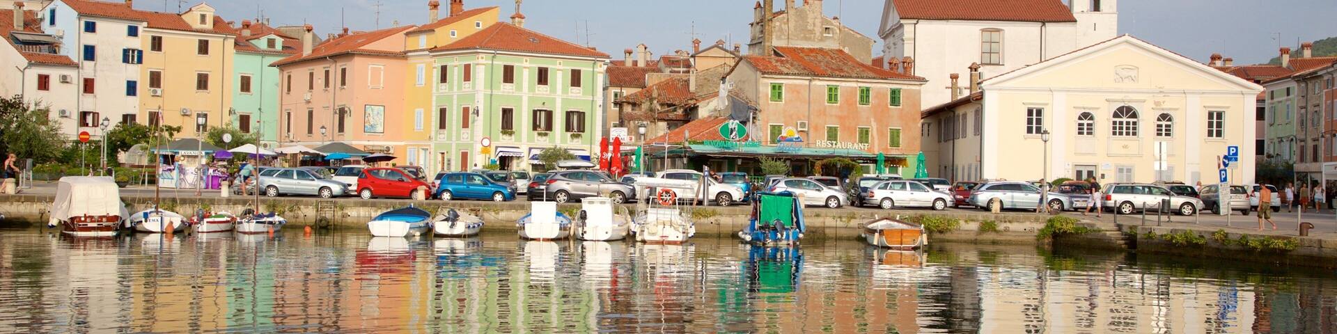 Izola Marina featuring a small town or village and a bay or harbor
